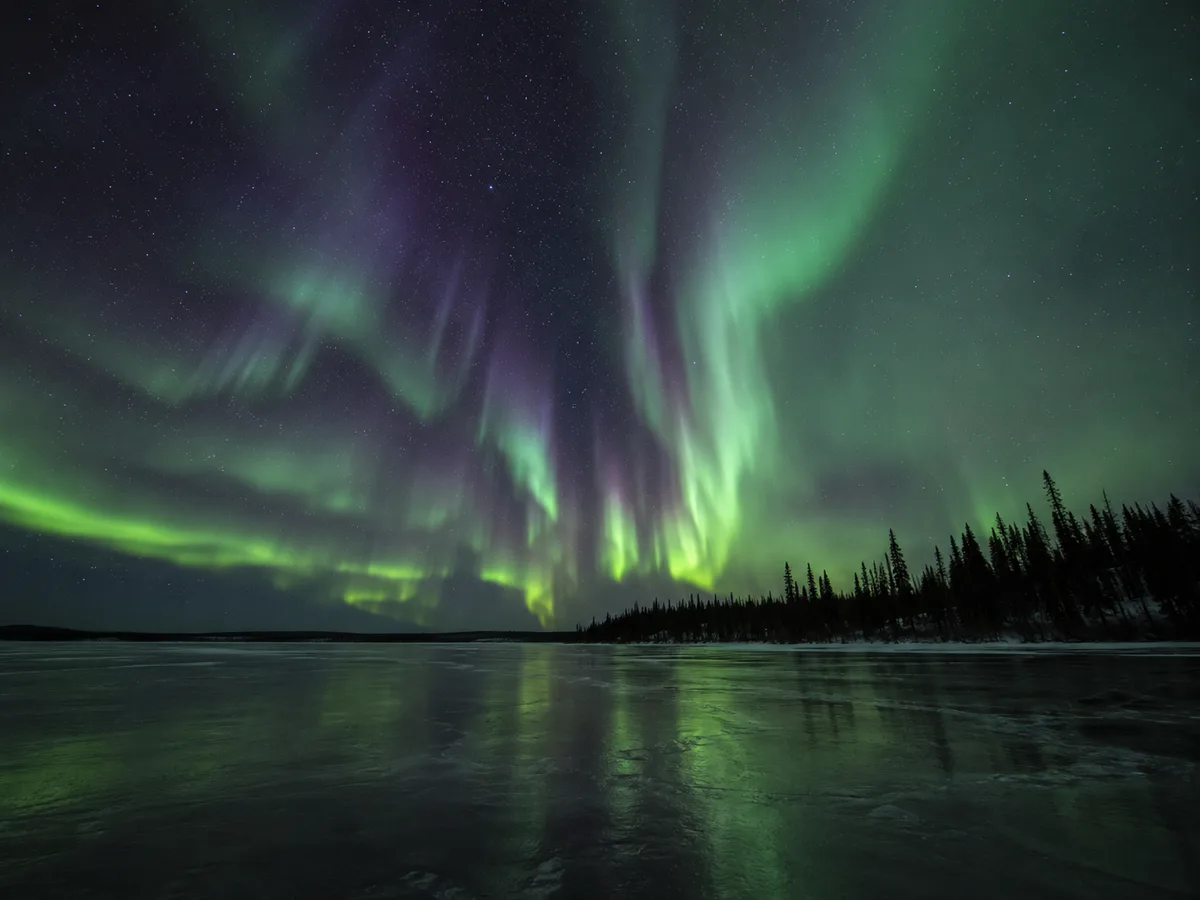 Aurora over frozen lake, Ingraham Trail